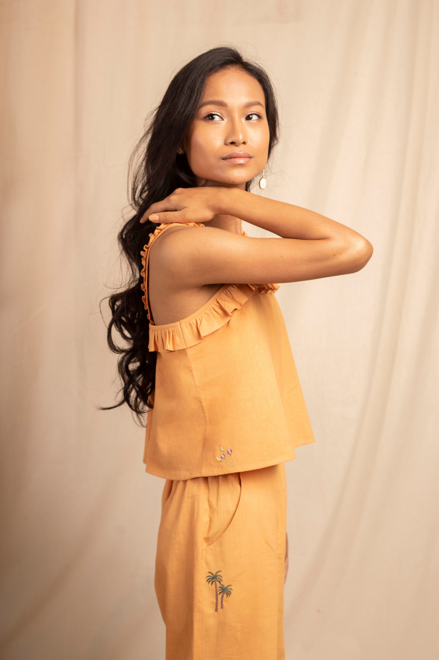 Sui | ARANCIA embroidered, herbal-dyed recycled fabric crop top with ruffle details from Granita Summer Collection 2019