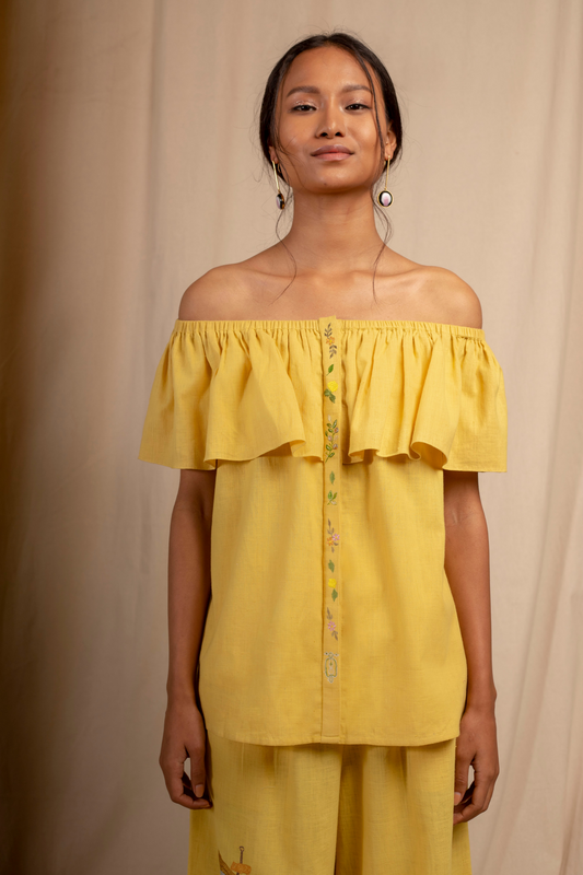 Sui | DAL PORTO embroidered, herbal-dyed handwoven organic cotton off-shoulder ruffled top from Granita Summer Collection 2019