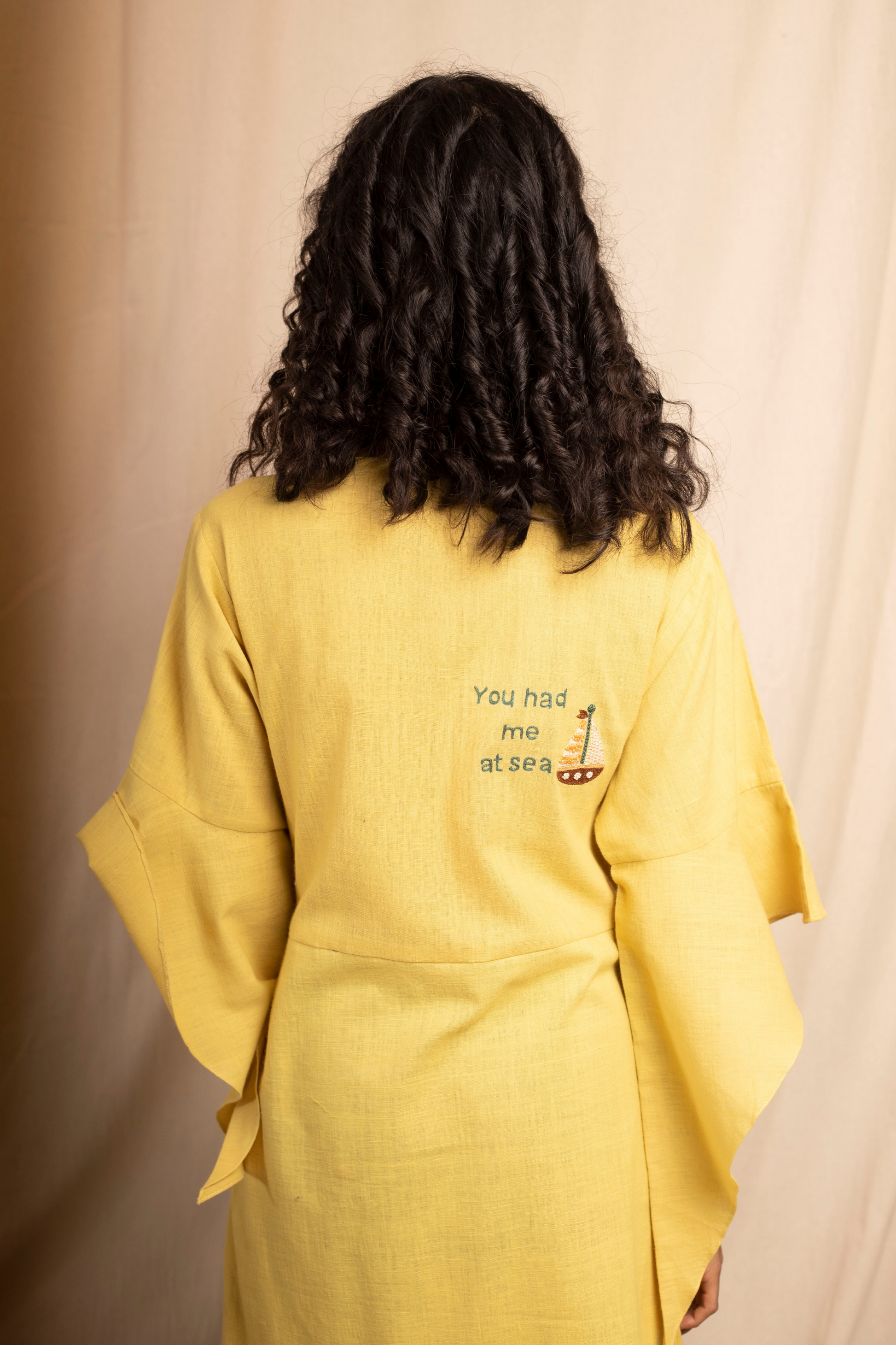 Sui | SERENO hand-embroidered, herbal-dyed handwoven organic cotton belted dress with ruffle details from Granita Summer Collection 2019